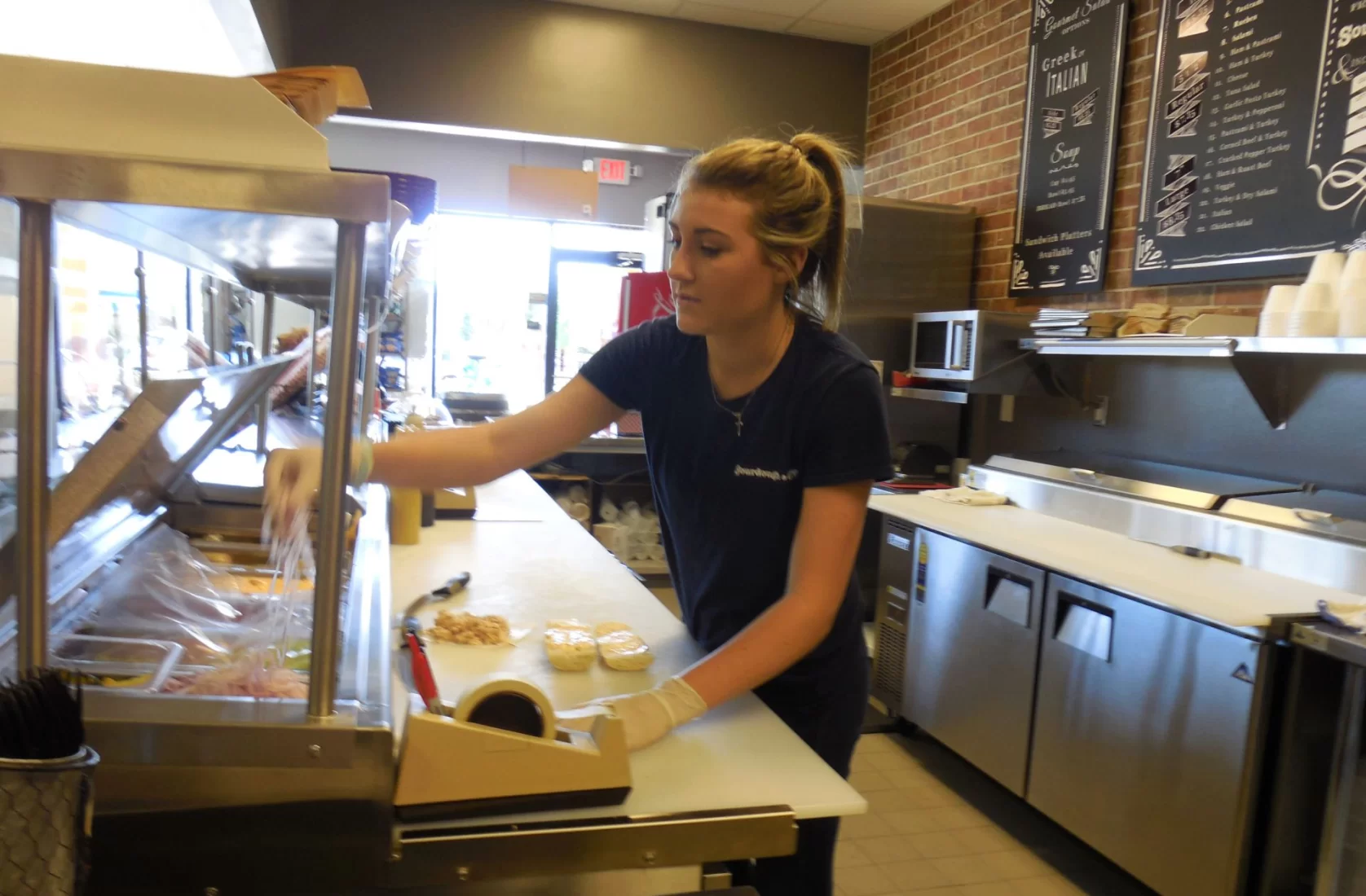 Team member preparing a Sourdough & Co. order