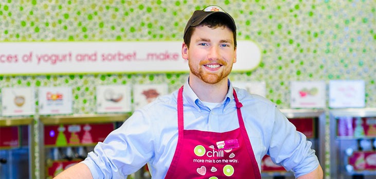 Menchie's team member behind the counter