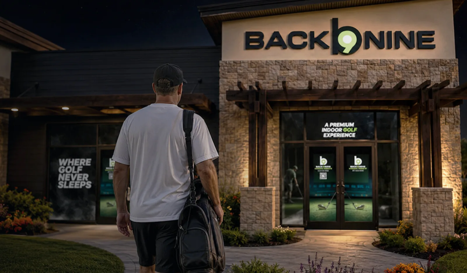 A golfer approaches the illuminated Back Nine storefront at night.