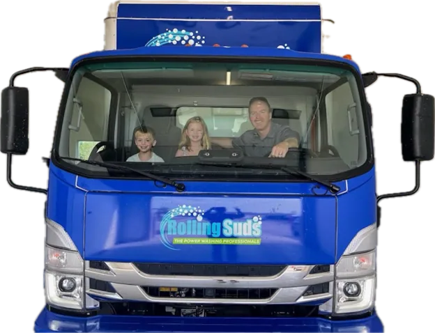 A family sits inside a Rolling Suds truck.