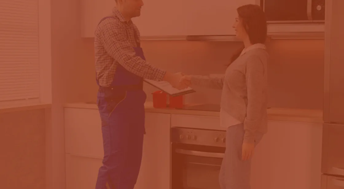 A home maintenance professional checking routine household details.