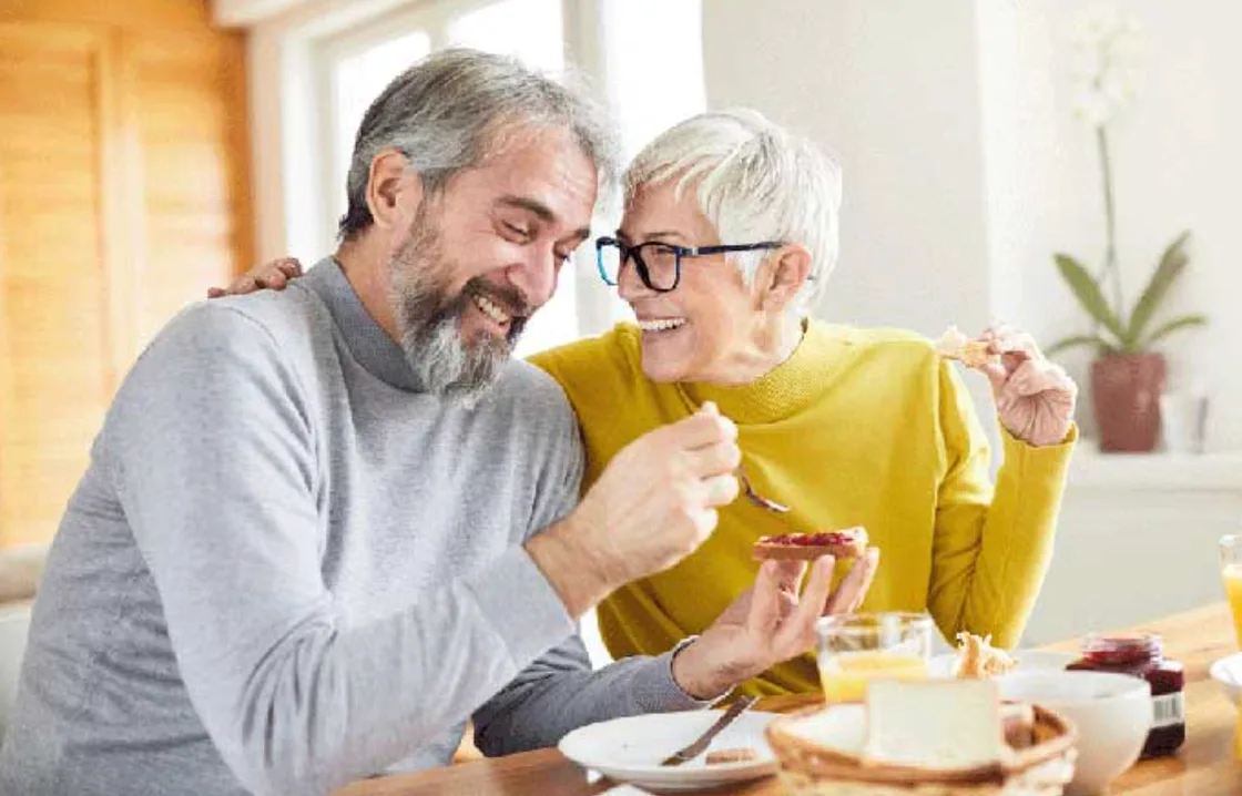 An older couple enjoying time together at home.